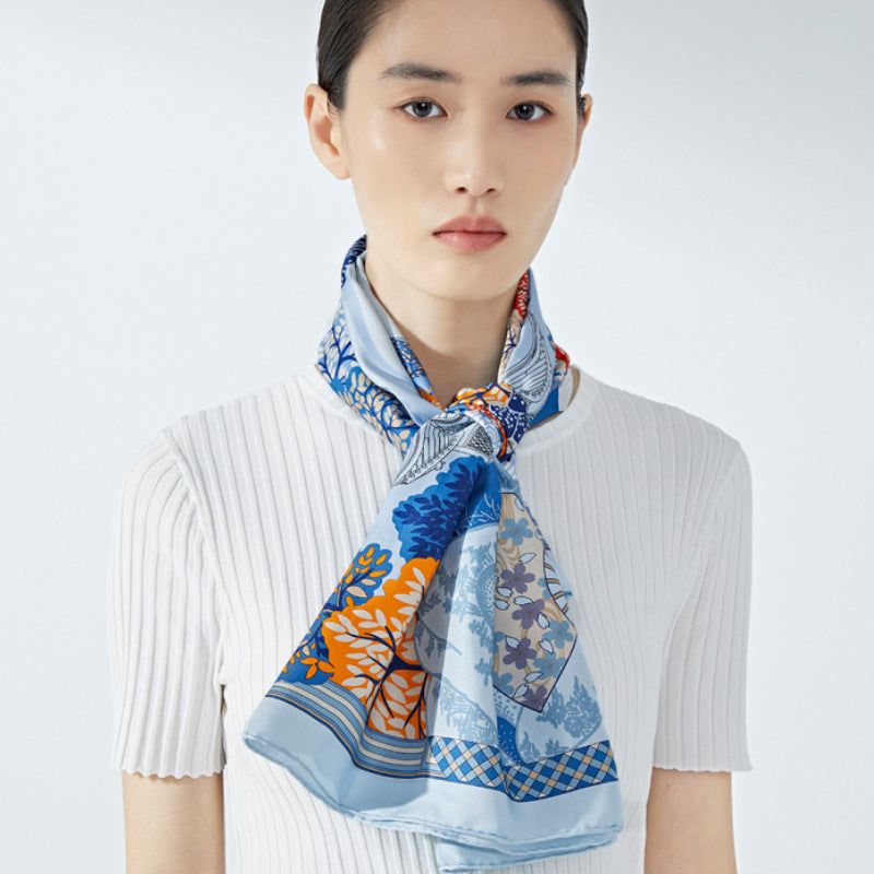 A lady wearing a silk square scarf