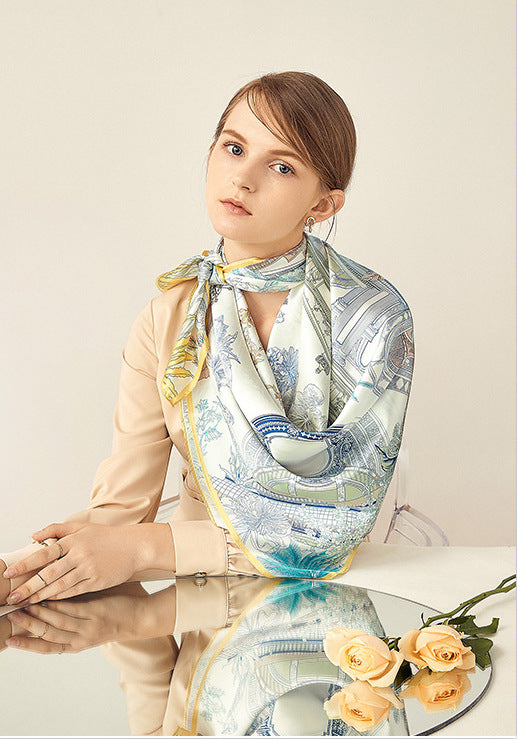 A lady wearing a silk square scarf